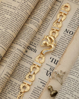 Alternative: Elegant Iced-Out Om Symbol Bracelet with Horseshoe-Style Links