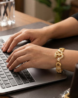 Alternative: Elegant Iced-Out Om Symbol Bracelet with Horseshoe-Style Links