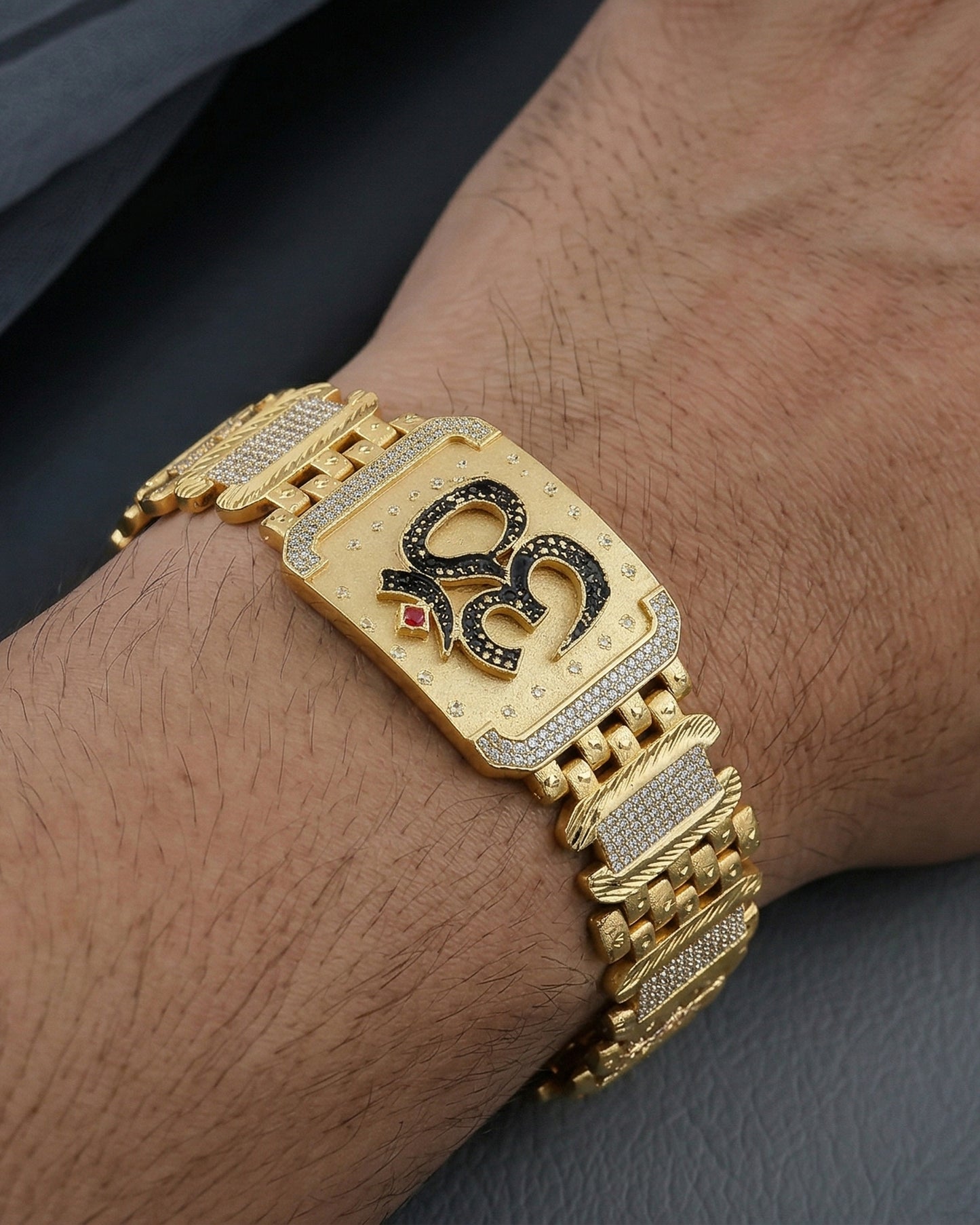 Bold Religious Statement Bracelet – Gold Tone Om Symbol with Diamond-Cut Accents