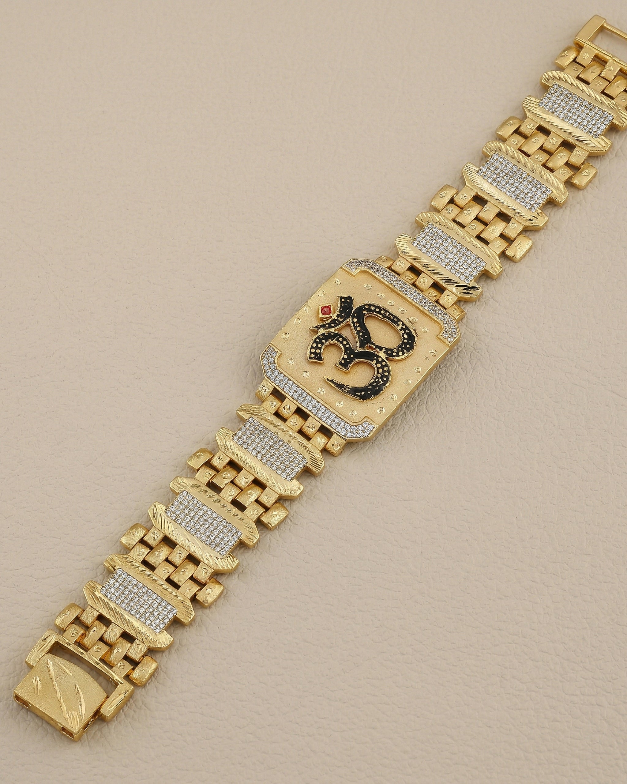 Bold Religious Statement Bracelet – Gold Tone Om Symbol with Diamond-Cut Accents